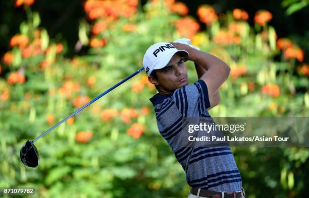 Ajeetesh Sandhu of India plays a shot during practice for the Resorts World Manila Masters at Manila Southwoods Golf and Country Club on November 7,...