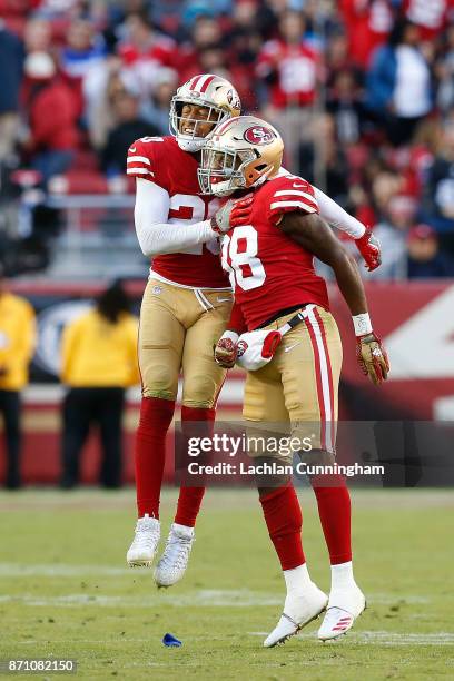 Leon Hall and Adrian Colbert of the San Francisco 49ers celebrate after w turnover against the Arizona Cardinals at Levi's Stadium on November 5,...