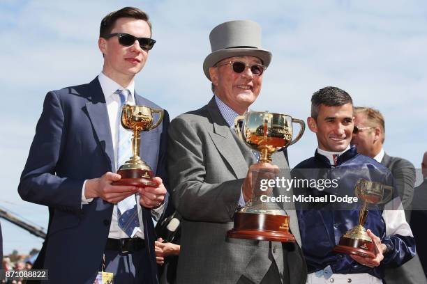 Owner Lloyd Williams poses with the Melbourne Cup with winning trainer Joseph O'Brien and jockey Corey Brown after winning on Rekindling to win race...