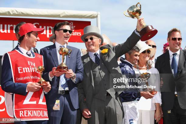 Owner Lloyd Williams poses with the Melbourne Cup with winning trainer Joseph O'Brien and jockey Corey Brown after winning on Rekindling to win race...