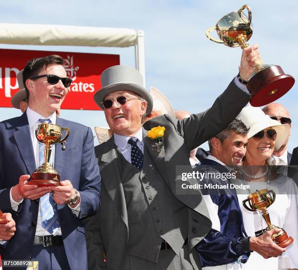 Owner Lloyd Williams poses with the Melbourne Cup with winning trainer Joseph O'Brien and jockey Corey Brown after winning on Rekindling to win race...