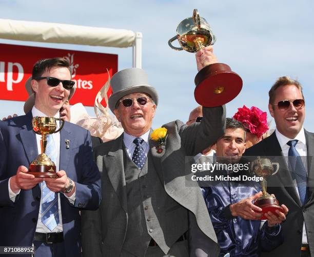 Owner Lloyd Williams poses with the Melbourne Cup with winning trainer Joseph O'Brien and jockey Corey Brown after winning on Rekindling to win race...