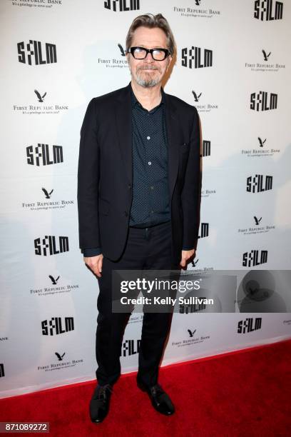 Darkest Hour" actor Gary Oldman poses for photos on the red carpet at the Castro Theatre on November 6, 2017 in San Francisco, California.