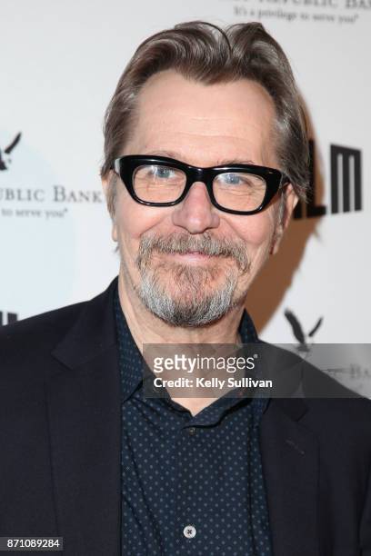 Darkest Hour" actor Gary Oldman poses for photos on the red carpet at the Castro Theatre on November 6, 2017 in San Francisco, California.
