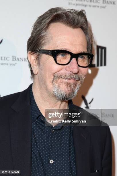 Darkest Hour" actor Gary Oldman poses for photos on the red carpet at the Castro Theatre on November 6, 2017 in San Francisco, California.