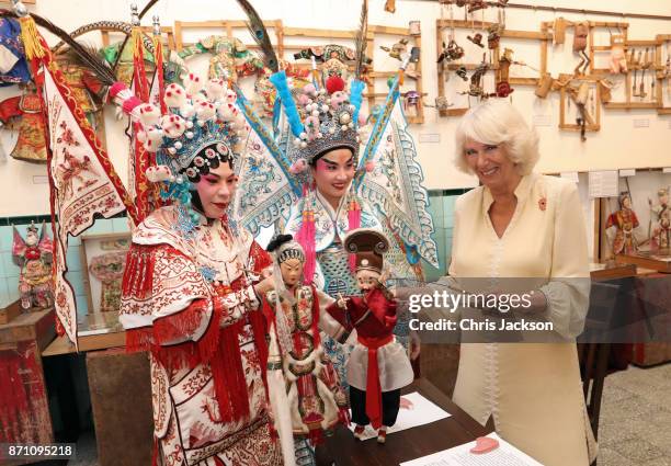 Camilla, Duchess of Cornwall takes part in a traditional puppet show at the Teochew Puppet & Opera House in George Town, Penang, Malaysia. Prince of...