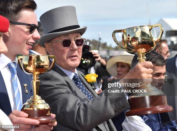 Lloyd Williams and trainer Joseph O'Brien smile after winning the sixth trophy and O'Brien his first after their horse Rekindling with jockey Corey...