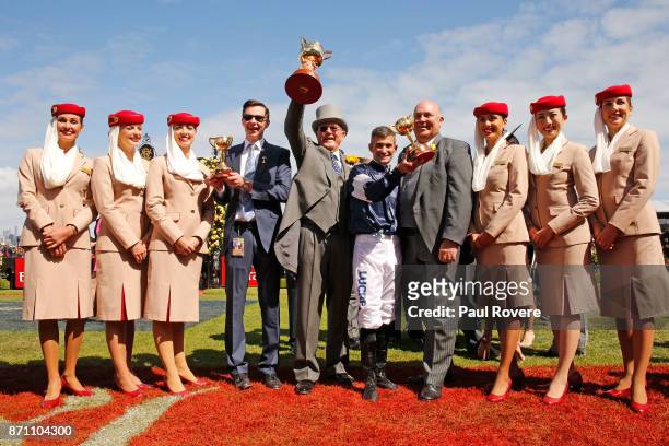 Trainer Joseph O'Brien, owner Lloyd Williams and jockey Corey Brown celebrate after winning race 7, the Emirates Melbourne Cup with their horse...
