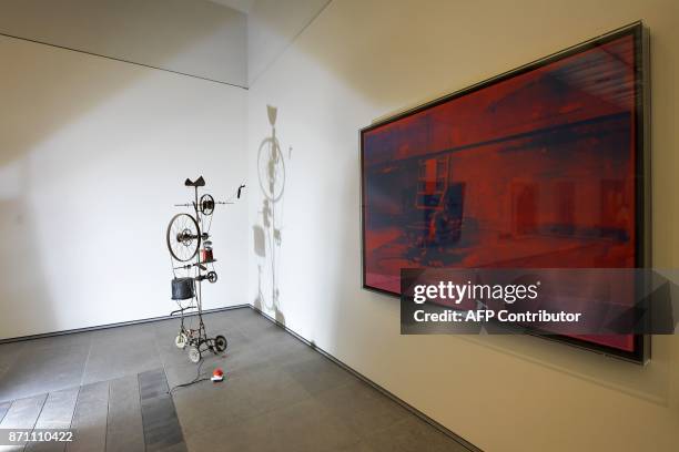 Painting titled "Big Electric Chair" by American artist Andy Warhol is displayed at the Louvre Abu Dhabi Museum during a media tour on November 6...