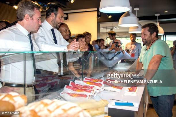 French Prime minister Edouard Philippe , flanked by Minister of State Jean-Baptiste Lemoyne meets a shopkeeper in Hope Estate district of Grand Case,...