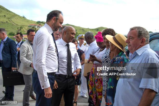 French Prime minister Edouard Philippe and President of Saint Martin's Conseil Territorial Daniel Gibbs meet shopkeepers in Hope Estate district of...