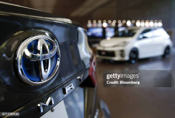 The Toyota Motor Corp. Logo is seen on a Camry sedan displayed at the company's offices in Tokyo, Japan, on Tuesday, Nov. 7, 2017. Toyota raised its...