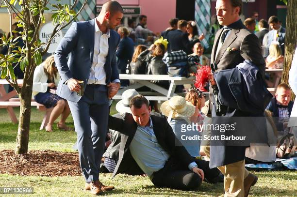 Racegoers make their way home at the conclusion of the 2017 Melbourne Cup Day at Flemington Racecourse on November 7, 2017 in Melbourne, Australia. A...