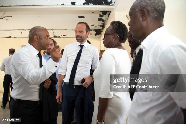 French Prime minister Edouard Philippe , listens to President of Saint Martin's Conseil Territorial Daniel Gibbs in Marigot, on the French overseas...