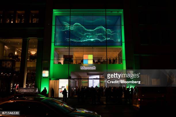 Traffic moves outside the Microsoft Corp. Flagship store during the Xbox One X game console global launch event in New York, U.S., on Monday, Nov. 6,...