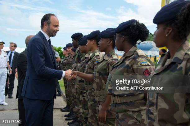 French Prime minister Edouard Philippe shakes hands with military women of the Compagnie de reserve de Territoire, in Quartier d'Orleans on the...