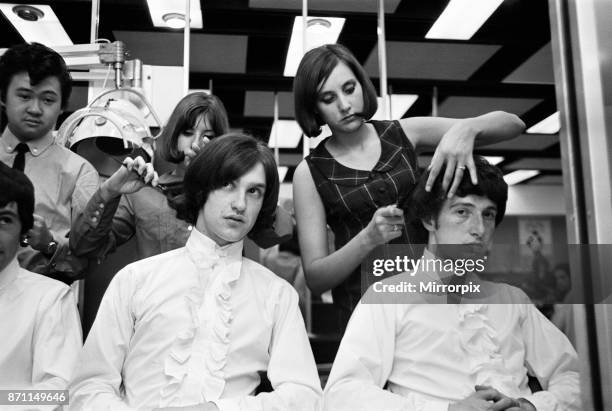 Members of the British pop group The Kinks having their hair styled at a salon, 12th June 1964.