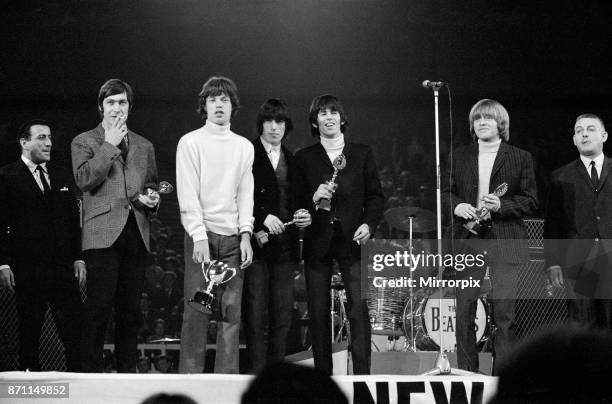 New Musical Express Poll Winners pop concert at Empire Pool Wembley, 1965. The Rolling Stones performing on stage during the concert. Left to right:...