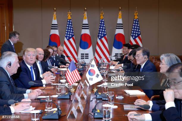 South Korean President Moon Jae-In talks with U.S. President Donald Trump during their summit at the presidential Blue House on November 7, 2017 in...