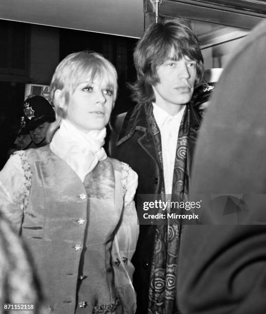 Rolling Stones pop group lead singer Mick Jagger, pictured with girlfriend Marianne Faithfull as they attend the premiere of the Stanley Kubrik...