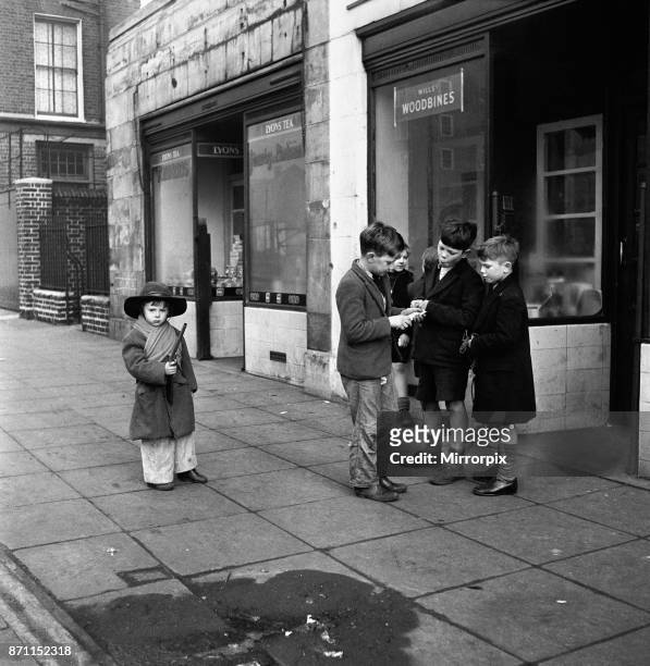 Life in the Mirror Our Gang, 19th January 1954, A gang of boys plot todays agenda of mischief and mayhem outside a tobacconist in Bow Road in the...