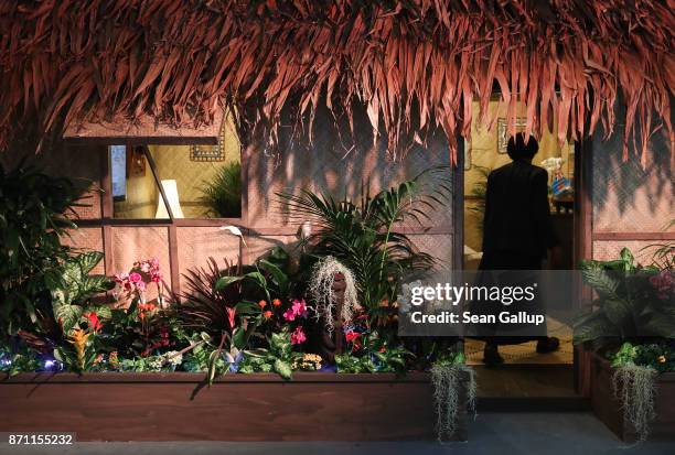 Woman enters a Fijian hut used for meetings at the Fiji pavilion in Bonn Zone at the COP 23 United Nations Climate Change Conference on November 7,...