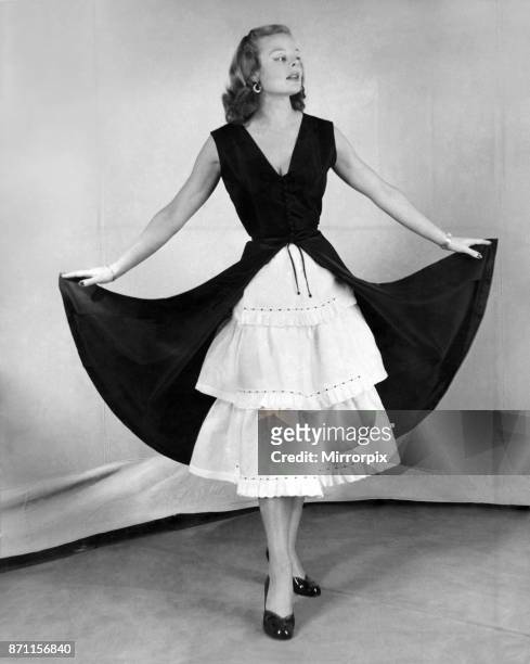 Model in a petticoat dress. December 1951.