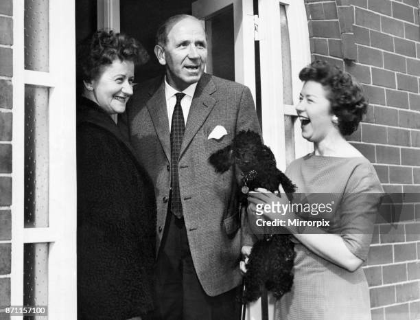 Matt Busby, Manchester United Manager, delighted to be back home in Charlton, after Munich Air Disaster, pictured with wife Jean and daughter Sheena,...