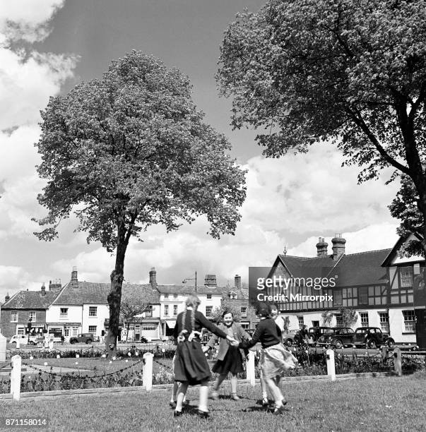 Five young girls holding hands and skipping in a circle, Beaconsfield, Buckinghamshire, 7th May 1952.