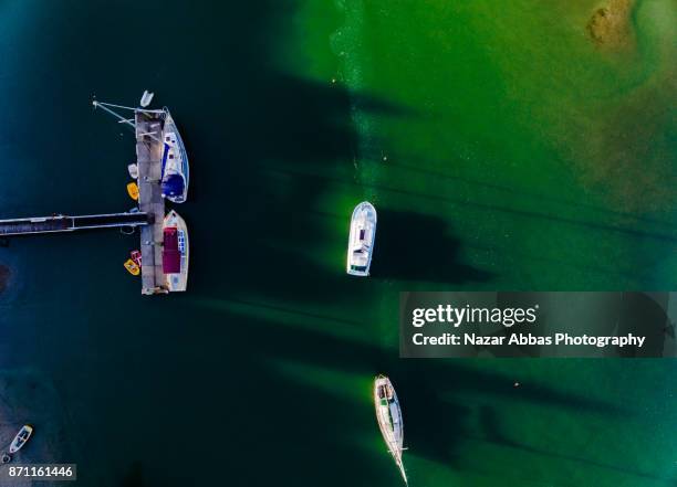 aerial view of boat parked. - whangaparoa peninsula stock pictures, royalty-free photos & images