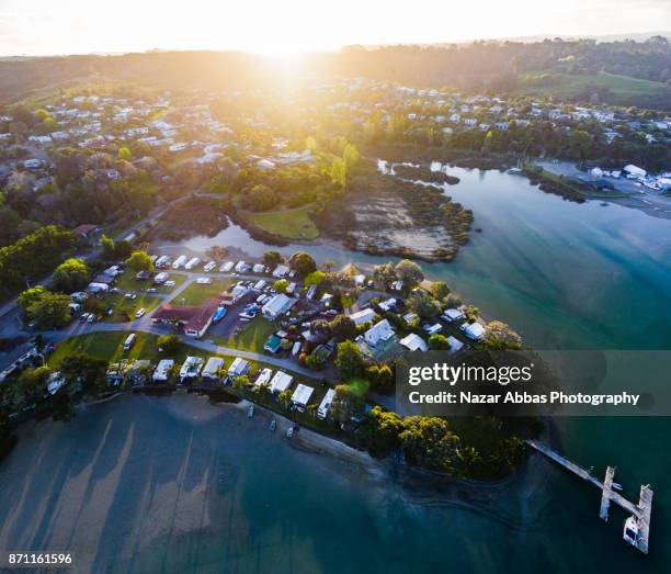 overhead view of small village stillwater, auckland, new zealand. - whangaparoa peninsula stock pictures, royalty-free photos & images