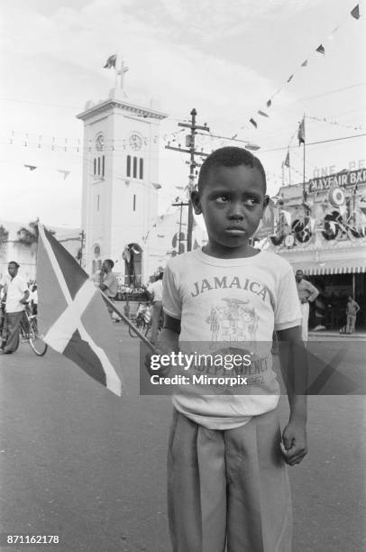 Small boy on the streets of Kingston less than impressed with the celebrations of Jamaician Independence, 6th August 1962.