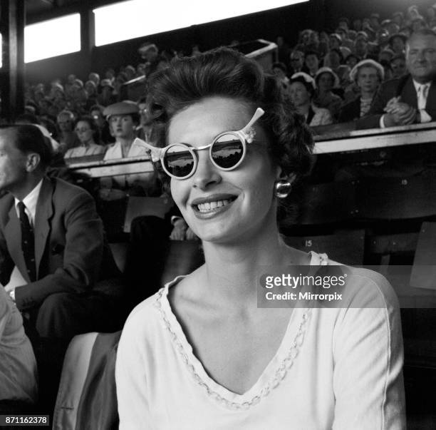 Tennis player Lorna Cawthorn taking a days rest to watch the action at Wimbledon, 27th June 1956.
