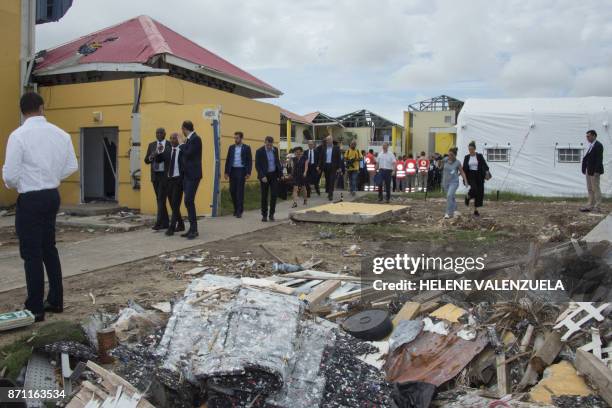 French Prime minister Edouard Philippe visits the damaged stadium of Marigot, on the French overseas island of Saint-Martin on November 6 during a...