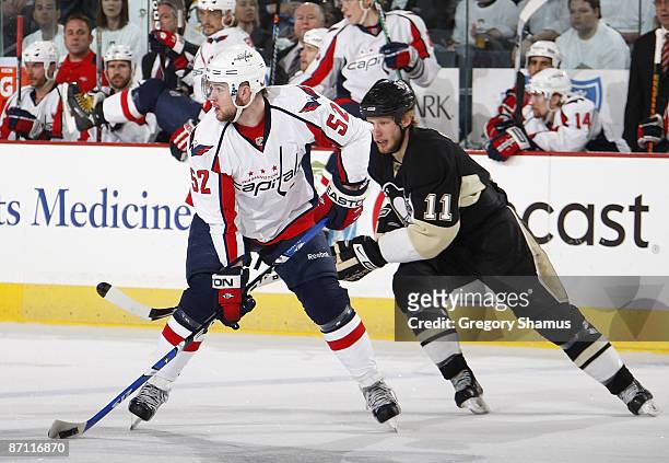 Jordan Staal of the Pittsburgh Penguins battles for position with Mike Green of the Washington Capitals during Game Six of the Eastern Conference...