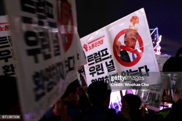 South Korean protesters take part in an anti-Trump rally in front of the US Embassy on November 7, 2017 in Seoul, South Korea. Trump is in South...