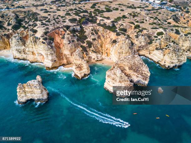 cliffs and sea stacks of ponta da piedade, algarve, portugal - ponta da piedade imagens e fotografias de stock