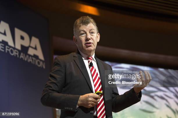 Paul Griffiths, chief executive officer of Dubai Airports, gestures as he speaks during the CAPA Asia Aviation and Corporate Travel Summit in...