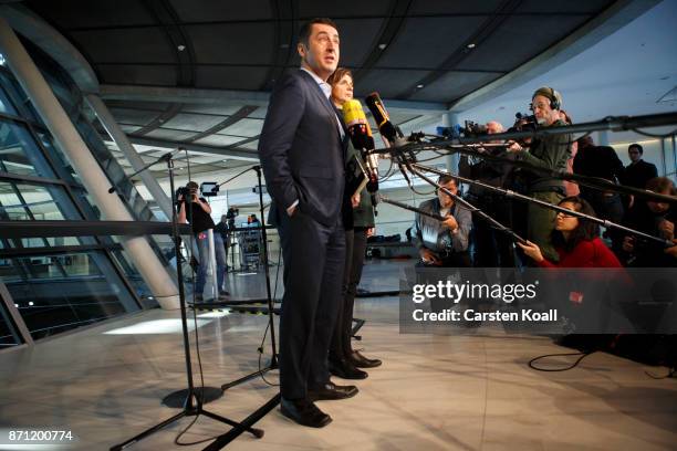 Cem Ozdemir and Katrin Goering-Eckardt leader of The Greens party, speak to the media during the second phase of coalition negotiations at the...