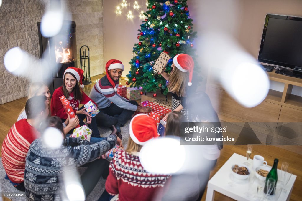 Group of people exchanging gifts