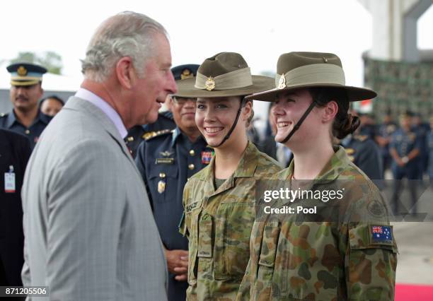 Prince Charles, Prince of Wales meets Private Brydie Schultz and Private Rachel Parise of the 19th Squadron of the Royal Australian Air Force, during...