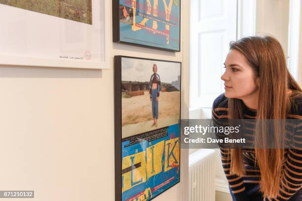 Visitor looks at a work by artist Jeremy Deller entitled 'Hallelujah! Shaun Ryder's Family Tree' during a press preview of 'North: Fashioning...