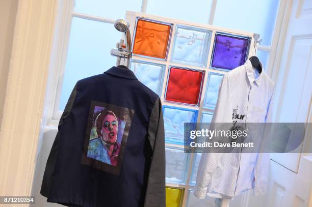 Collection by fashion designer Paul Smith, featuring artwork by Jeremy Deller of Shaun Ryder, on display during a press preview of 'North: Fashioning...