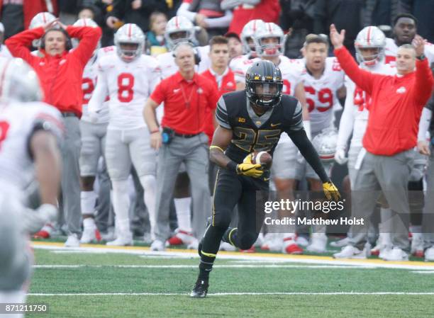 Running back Akrum Wadley of the Iowa Hawkeyes rushes up field during the second quarter against the Ohio State Buckeyes on November 04, 2017 at...