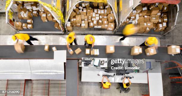 boxes on conveyor belt - plant from above stock pictures, royalty-free photos & images