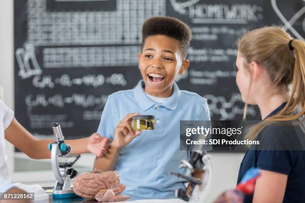 handsome preteen middle school student participates in science lab - brain in a jar stock pictures, royalty-free photos & images