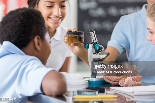 group of young science lab partners in biology class - brain in a jar stock pictures, royalty-free photos & images