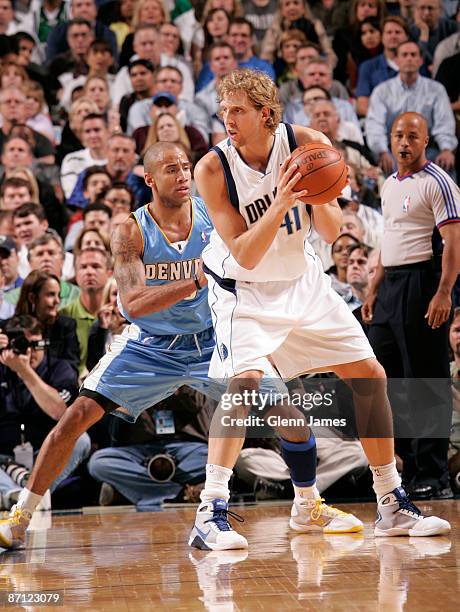 Dirk Nowitzki of the Dallas Mavericks posts up against Dahntay Jones of the Denver Nuggets in Game Four of the Western Conference Semifinals during...