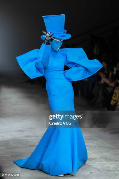 Model showcases designs on the runway at Sheguang Hu Haute Couture collection during the Mercedes-Benz China Fashion Week Spring/Summer 2018 at...