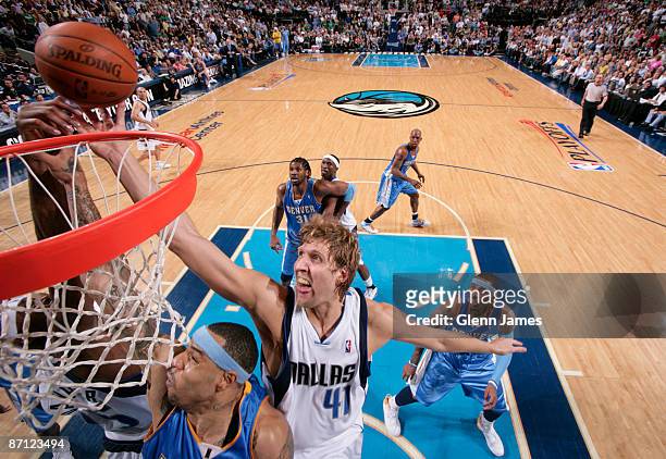 Kenyon Martin of the Denver Nuggets goes up for the layup against Dirk Nowitzki of the Dallas Mavericks in Game Four of the Western Conference...